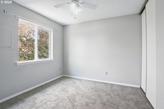5594 SW Murray Blvd, Beaverton, OR 97005 - spare room with carpet flooring, a ceiling fan, a textured ceiling, and baseboards