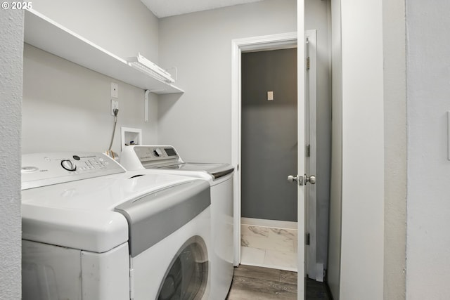 5594 SW Murray Blvd, Beaverton, OR 97005 - clothes washing area with washing machine and clothes dryer, laundry area, baseboards, and marble finish floor