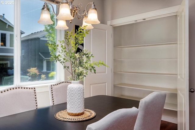 dining space with a chandelier