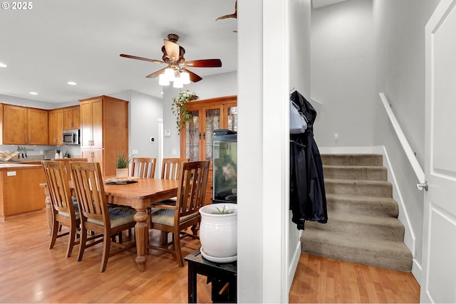 3730 Hemlock Pl SE, Albany, OR 97322 - dining space featuring stairway, ceiling fan, light wood-type flooring, and recessed lighting