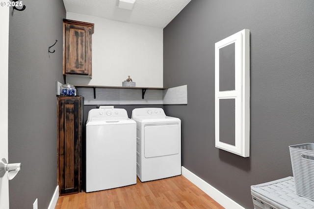 3730 Hemlock Pl SE, Albany, OR 97322 - laundry room with separate washer and dryer, light wood finished floors, and baseboards