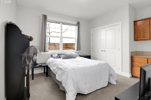 carpeted bedroom with a closet