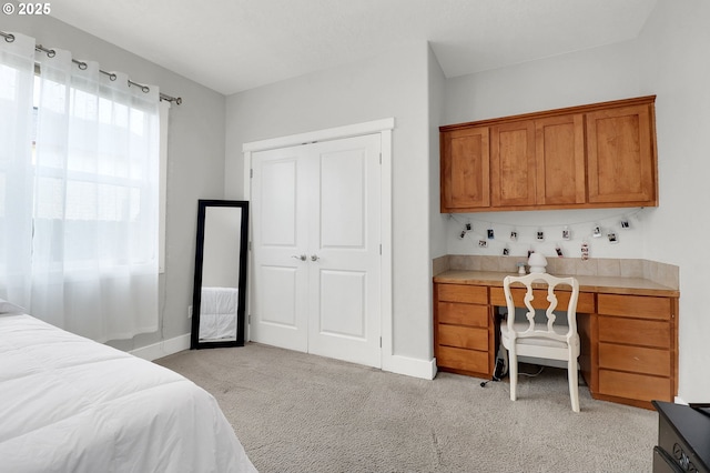 carpeted bedroom with a closet