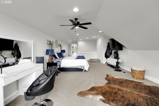 carpeted bedroom featuring vaulted ceiling and ceiling fan