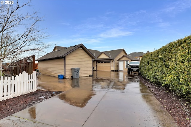 view of side of property with a garage