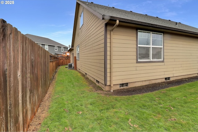 view of property exterior featuring a yard and central AC