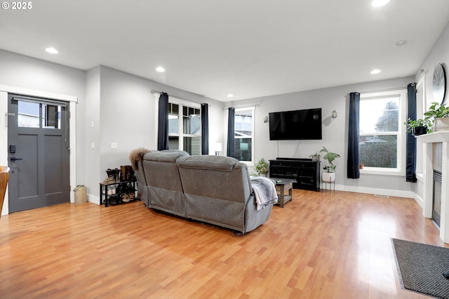 3730 Hemlock Pl SE, Albany, OR 97322 - living area with recessed lighting, plenty of natural light, light wood-style flooring, and a glass covered fireplace