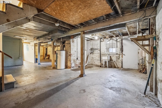 basement featuring sink and water heater