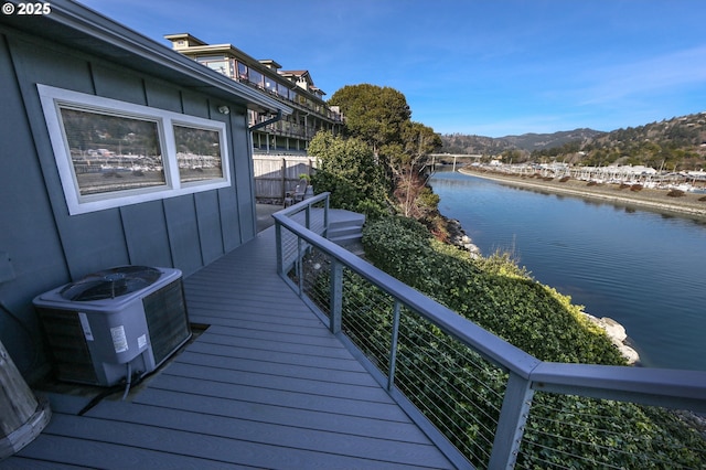 balcony with cooling unit and a water and mountain view