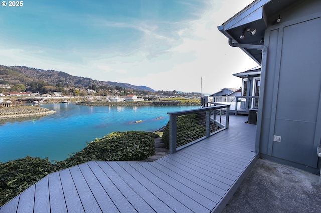 dock area featuring a water and mountain view