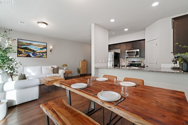 dining room with dark hardwood / wood-style floors