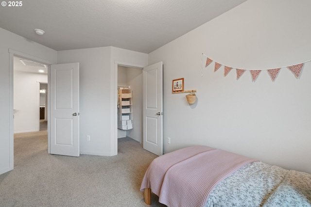 bedroom featuring light carpet