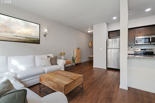 living room featuring dark wood-type flooring