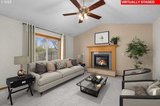 carpeted living room with vaulted ceiling and ceiling fan