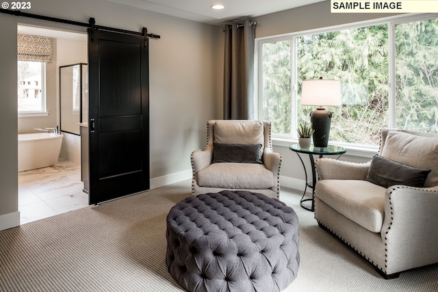 366 S 87th Ave, Ridgefield, WA 98642 - living area featuring plenty of natural light, recessed lighting, a barn door, and baseboards