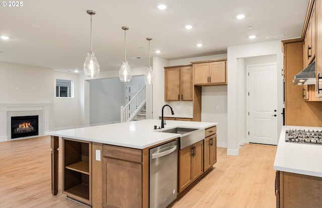 366 S 87th Ave, Ridgefield, WA 98642 - kitchen with a sink, stainless steel appliances, light wood-type flooring, brown cabinets, and recessed lighting