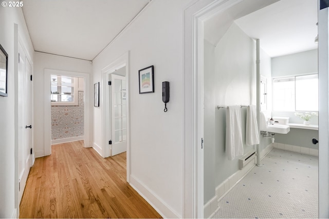 2829 SE Belmont St Unit 205, Portland, OR 97214 - hall with an office area, light wood-style flooring, and baseboard heating