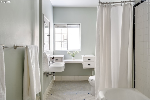 2829 SE Belmont St Unit 205, Portland, OR 97214 - full bathroom with toilet and baseboards