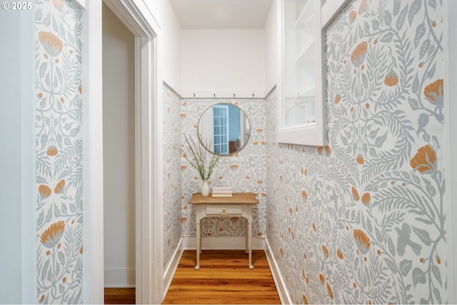 2829 SE Belmont St Unit 205, Portland, OR 97214 - corridor featuring wallpapered walls and wood finished floors