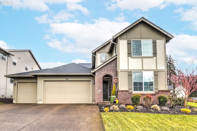 view of front of property featuring a garage and a front yard