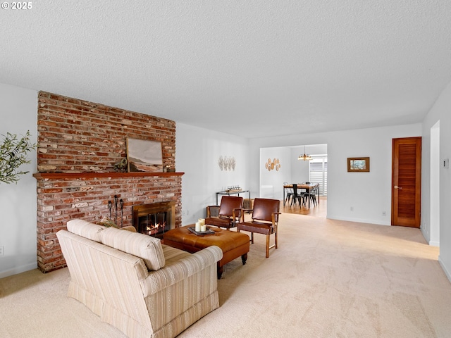 living room with a fireplace, light colored carpet, and a textured ceiling