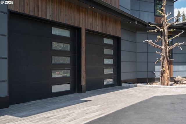 view of exterior entry with a garage