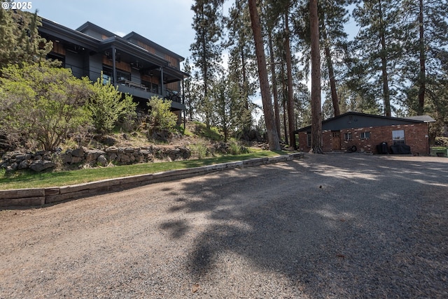 view of property exterior featuring gravel driveway