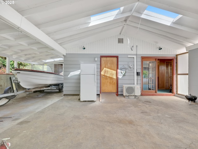 450 Pleasant Ave, Astoria, OR 97103 - interior space with a skylight, vaulted ceiling, and concrete floors