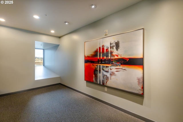 empty room featuring recessed lighting and baseboards