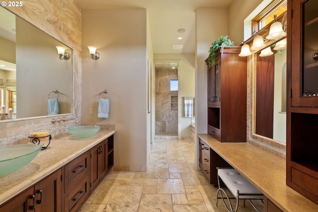 16465 Suntree Ln, Sisters, OR 97759 - bathroom featuring double vanity and stone tile flooring