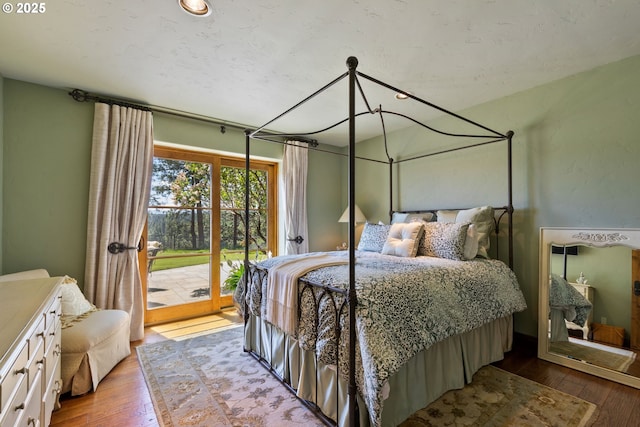16465 Suntree Ln, Sisters, OR 97759 - bedroom with access to outside and hardwood / wood-style flooring