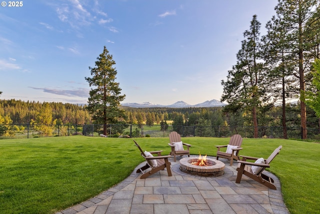 16465 Suntree Ln, Sisters, OR 97759 - view of patio / terrace with a fire pit, a mountain view, and a forest view