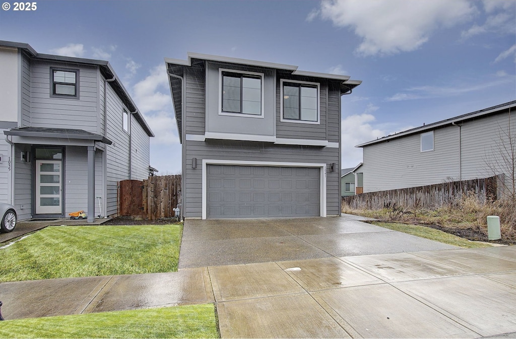 view of front facade with a garage and a front yard