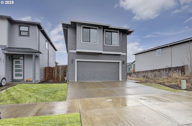 view of front facade with a garage and a front yard