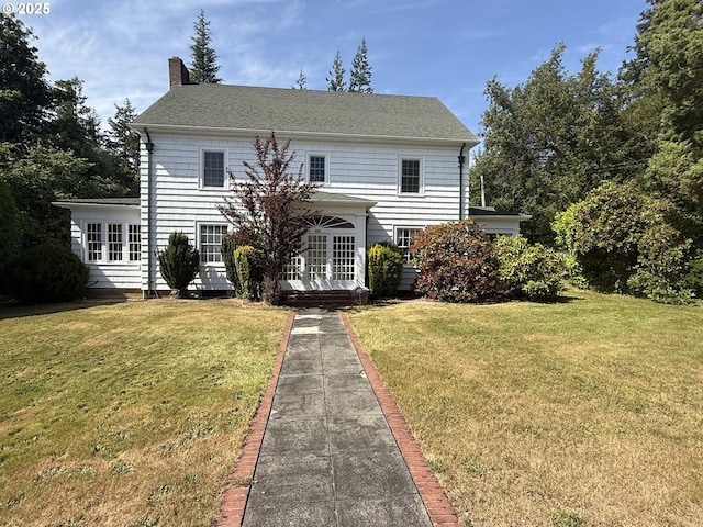 880 E 2nd St, Coquille, OR 97423 - view of front of home with a chimney, a front yard, and a shingled roof