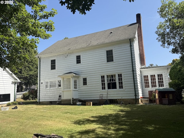 880 E 2nd St, Coquille, OR 97423 - rear view of house featuring a chimney, entry steps, and a yard