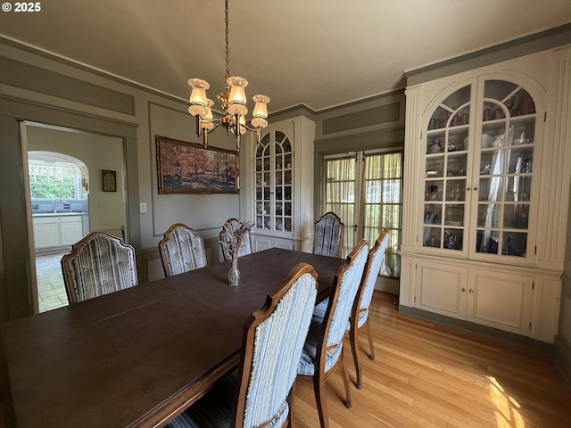 880 E 2nd St, Coquille, OR 97423 - dining space featuring a chandelier and light wood-style floors