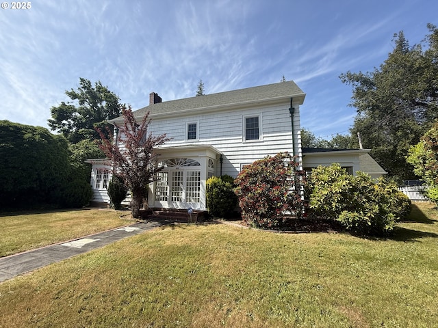 880 E 2nd St, Coquille, OR 97423 - rear view of house with french doors, a chimney, and a yard