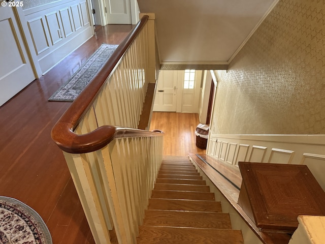 880 E 2nd St, Coquille, OR 97423 - stairway with wood finished floors, a decorative wall, crown molding, and wallpapered walls