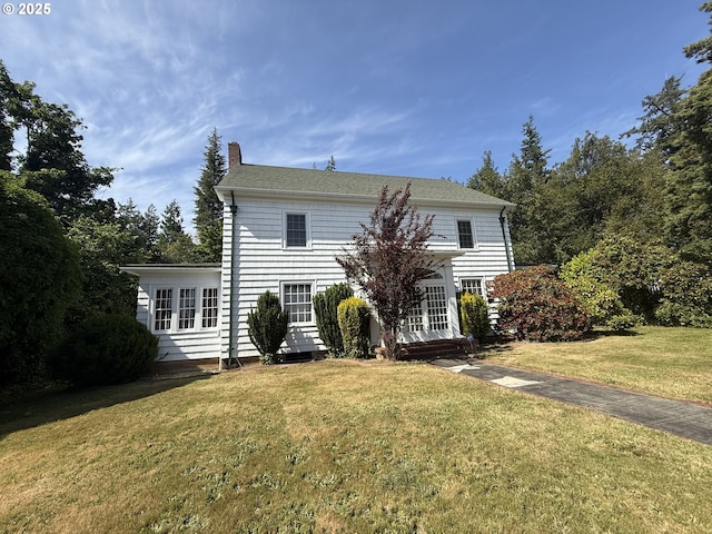 880 E 2nd St, Coquille, OR 97423 - view of front of house with a chimney, a front yard, and a shingled roof