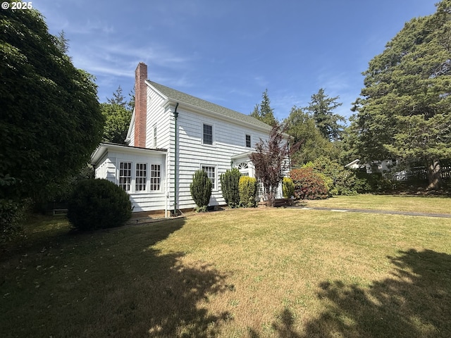 880 E 2nd St, Coquille, OR 97423 - view of side of home featuring a chimney and a lawn