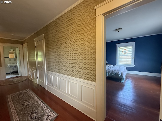 880 E 2nd St, Coquille, OR 97423 - hall with ornamental molding, wallpapered walls, wood finished floors, and a wainscoted wall