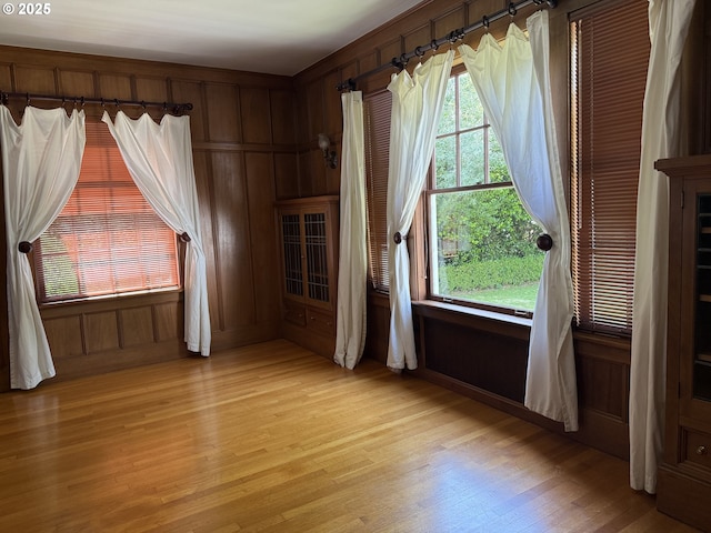 880 E 2nd St, Coquille, OR 97423 - spare room featuring healthy amount of natural light, light wood-style floors, and wood walls