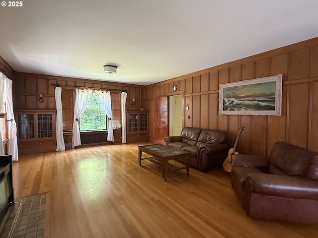 880 E 2nd St, Coquille, OR 97423 - living area featuring light wood-style floors and wooden walls