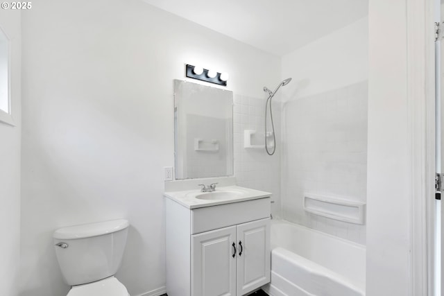 bathroom with vanity, washtub / shower combination, and toilet