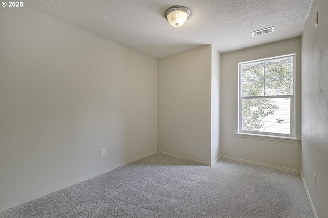 1115 NE 86th Way, Hillsboro, OR 97006 - carpeted spare room featuring a textured ceiling and baseboards
