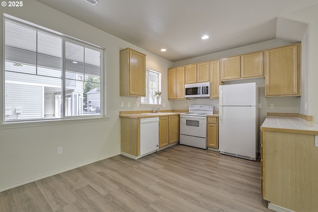 1115 NE 86th Way, Hillsboro, OR 97006 - kitchen featuring white appliances, light brown cabinetry, light wood-type flooring, tile countertops, and recessed lighting