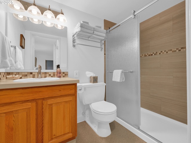 1146 N Marion Ave Unit 628, Gearhart, OR 97138 - bathroom with a shower, toilet, vanity, and tasteful backsplash