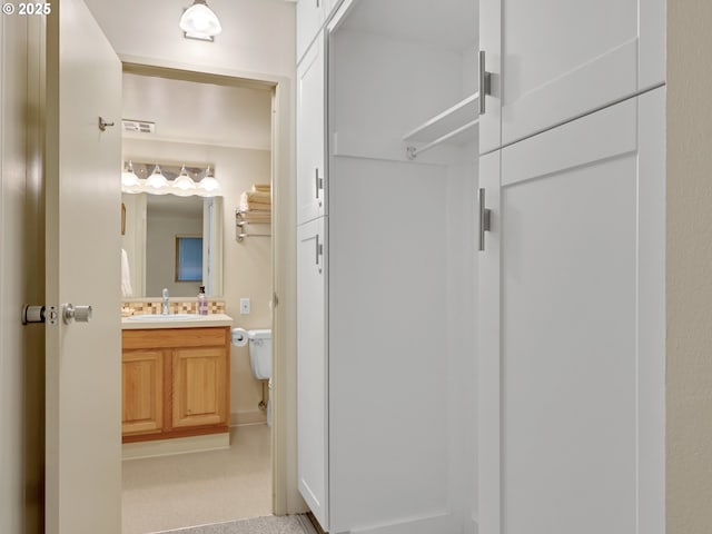 1146 N Marion Ave Unit 628, Gearhart, OR 97138 - half bathroom with vanity and toilet