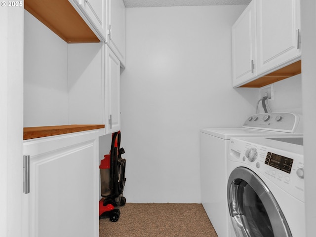 1146 N Marion Ave Unit 628, Gearhart, OR 97138 - laundry area featuring cabinet space, washing machine and clothes dryer, and carpet flooring